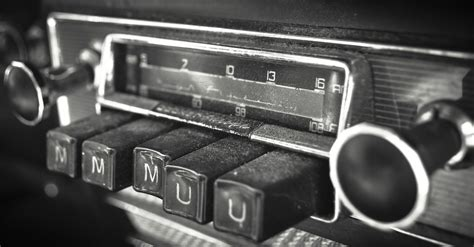 a close up of a radio button dashboard of a car with very pronounced, tactile buttons